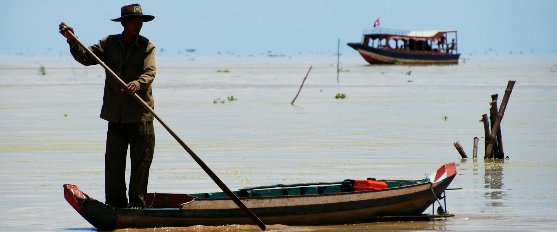 Mekong River sunset in Kampong Cham on a scenic Kampong Cham Travel banner by Legend Travel Group.